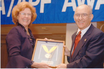 Dr. Cantor presenting award to Dr. Sattler